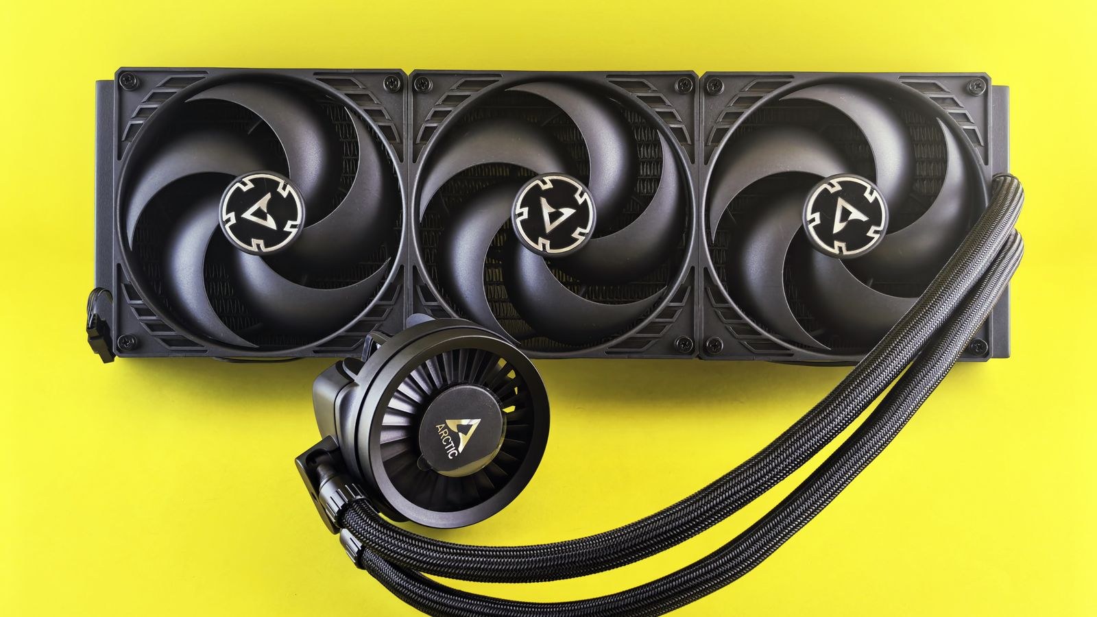 Close-up of AIO radiator fins and cooling fans inside a computer