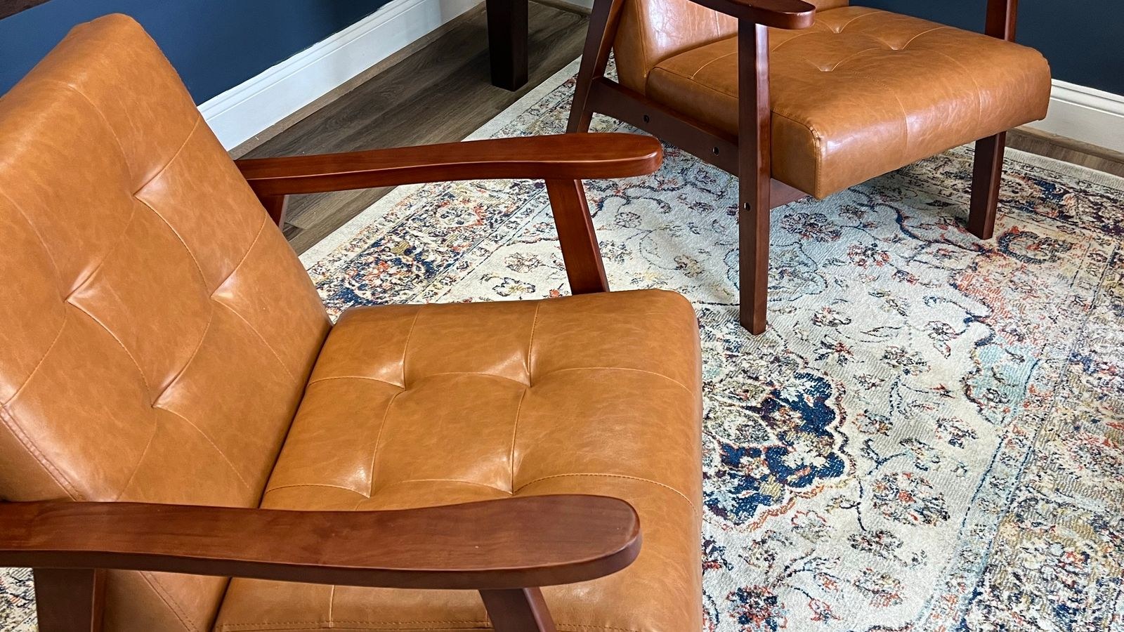 Pair of accent chairs on a rug facing a window