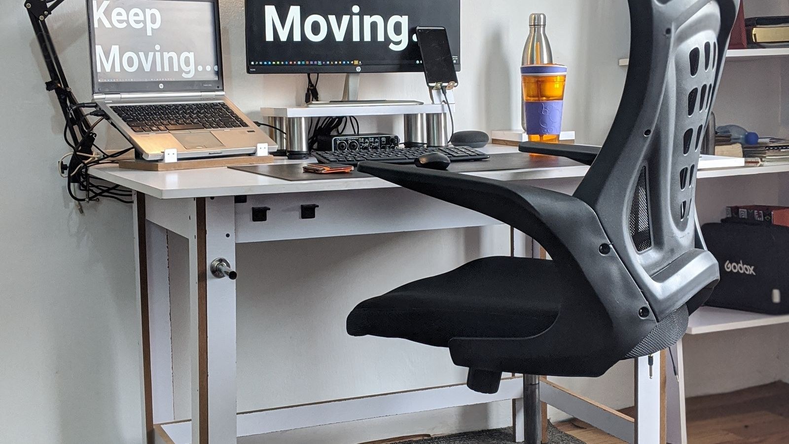 Exercise ball chair and active stool beside a home office desk