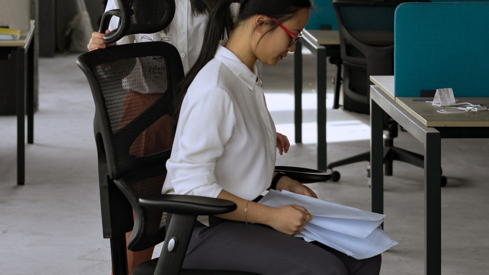 Adjustable height stool and workspace seating options in a bright room