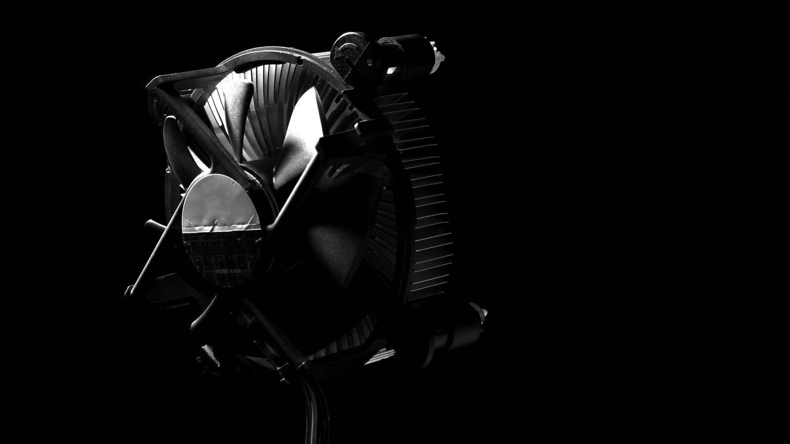 Compact PC build with RGB cooling fans glowing inside the case