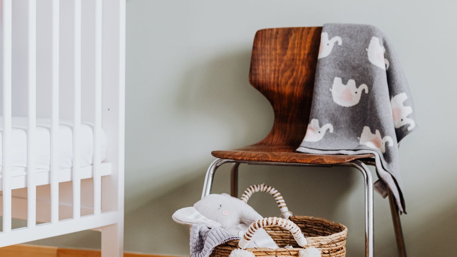 Nursery interior with a crib and a camera monitoring the room
