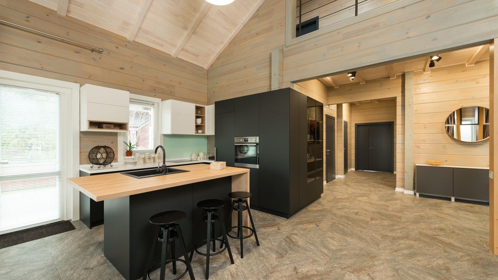 Bar stools lined up at a kitchen counter