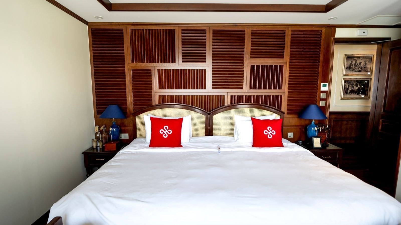 Elegant bedroom with wood accents and a king sized bed with nightstands