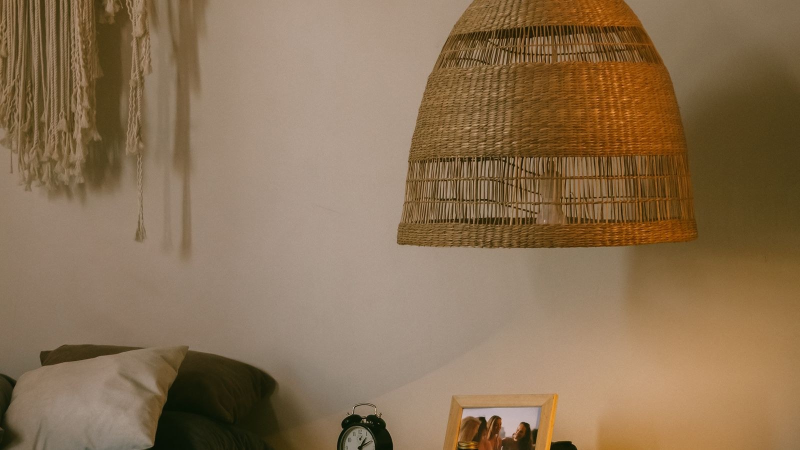 Cozy bedroom with warm accent lighting and layered textiles