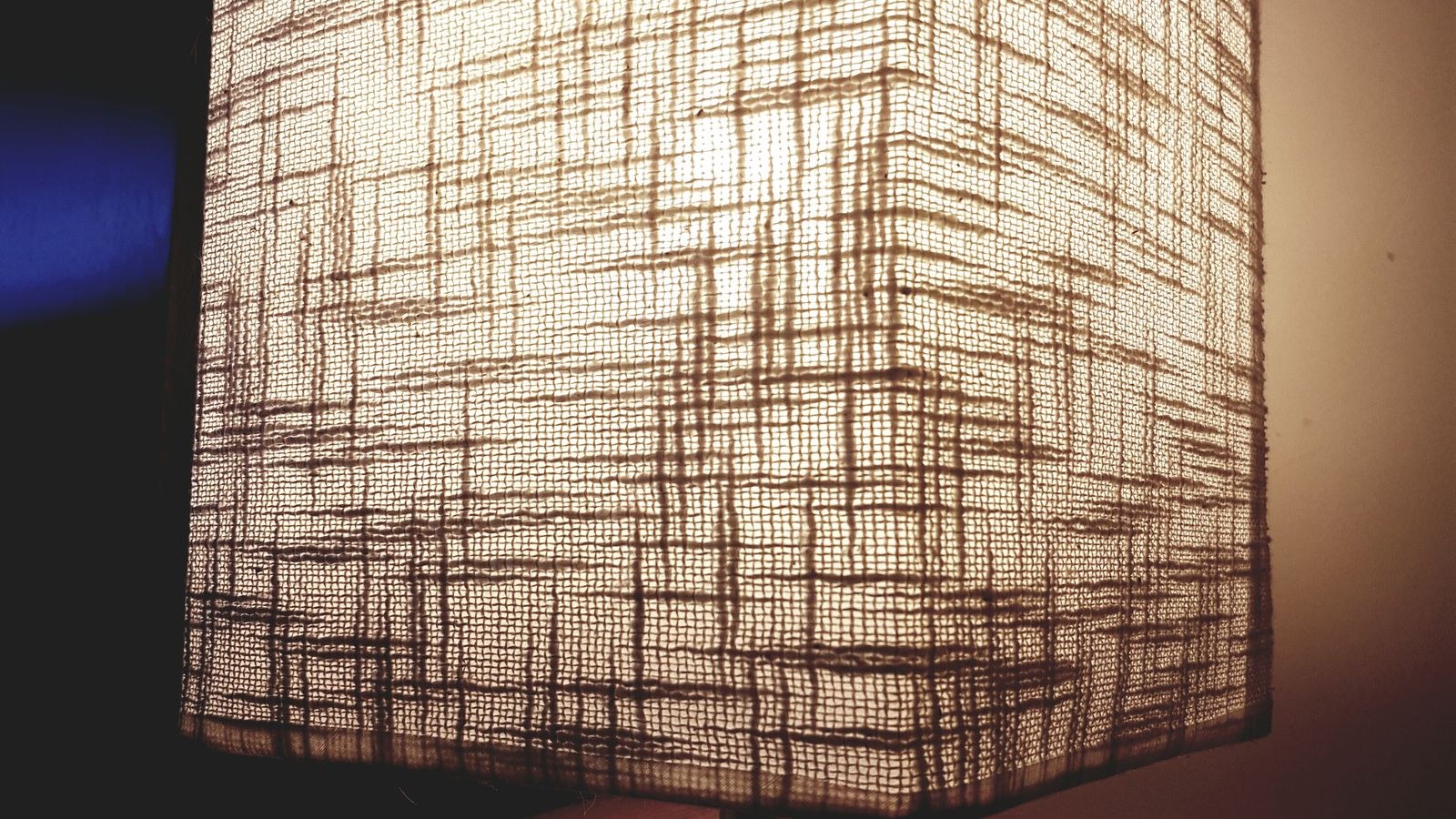 Living room lamp switched on at dusk to simulate occupancy