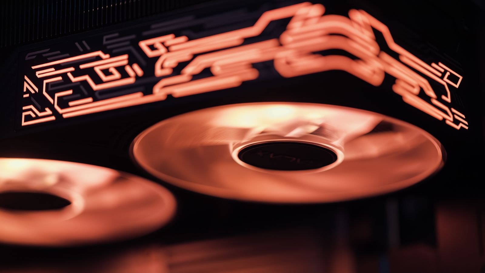 Water cooling radiator fans glowing inside a custom loop PC build