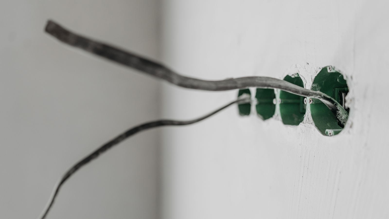 Exposed electrical wiring at a wall opening during a home installation