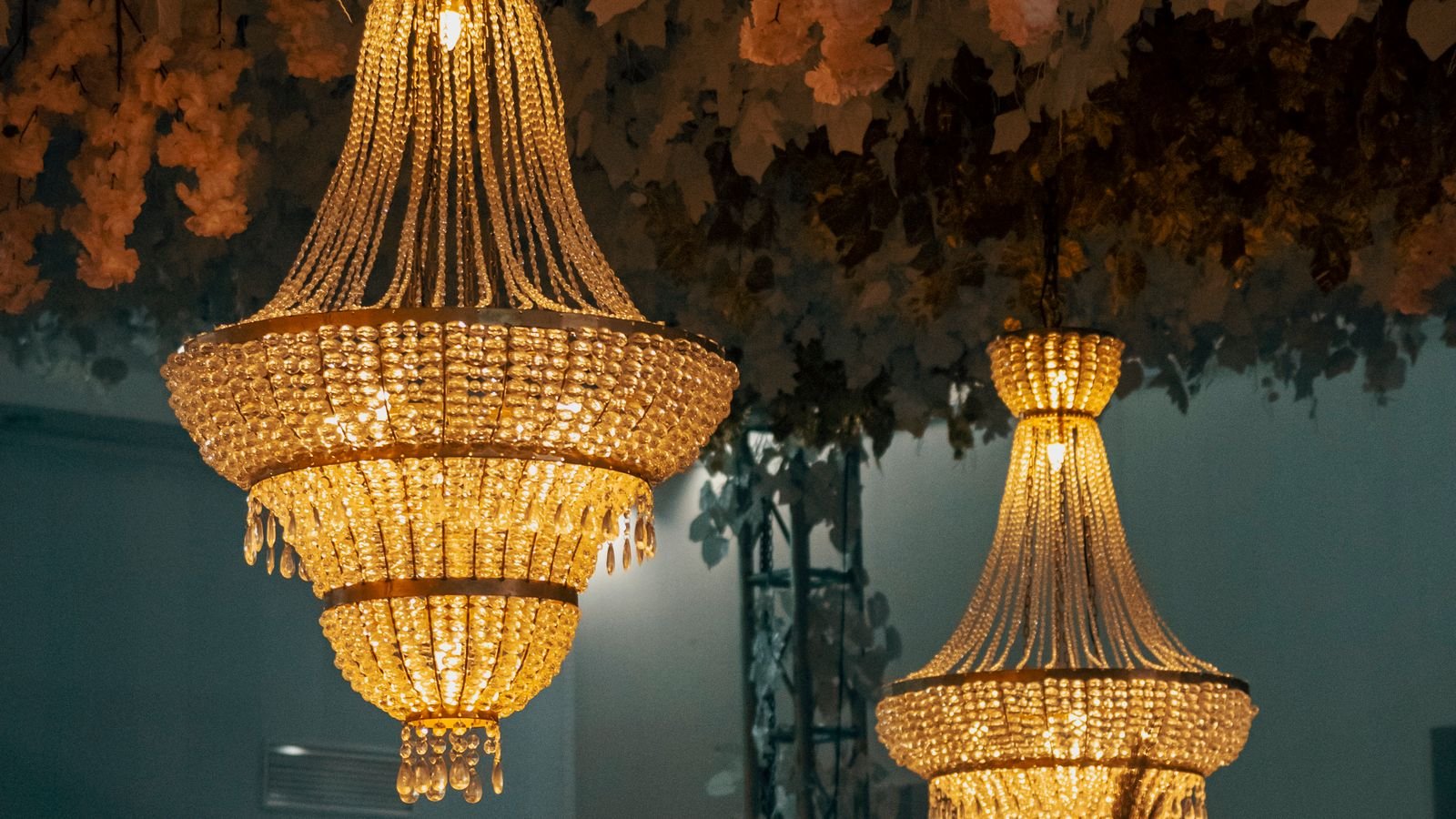 Crystal chandelier with warm candelabra bulbs in a dining room