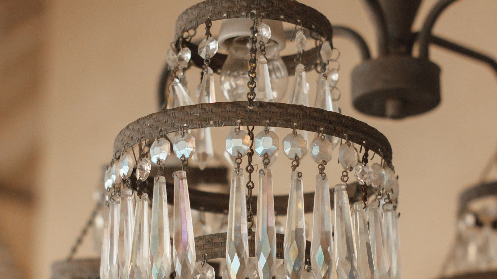 Close-up of a vintage crystal chandelier showing intricate glass detail