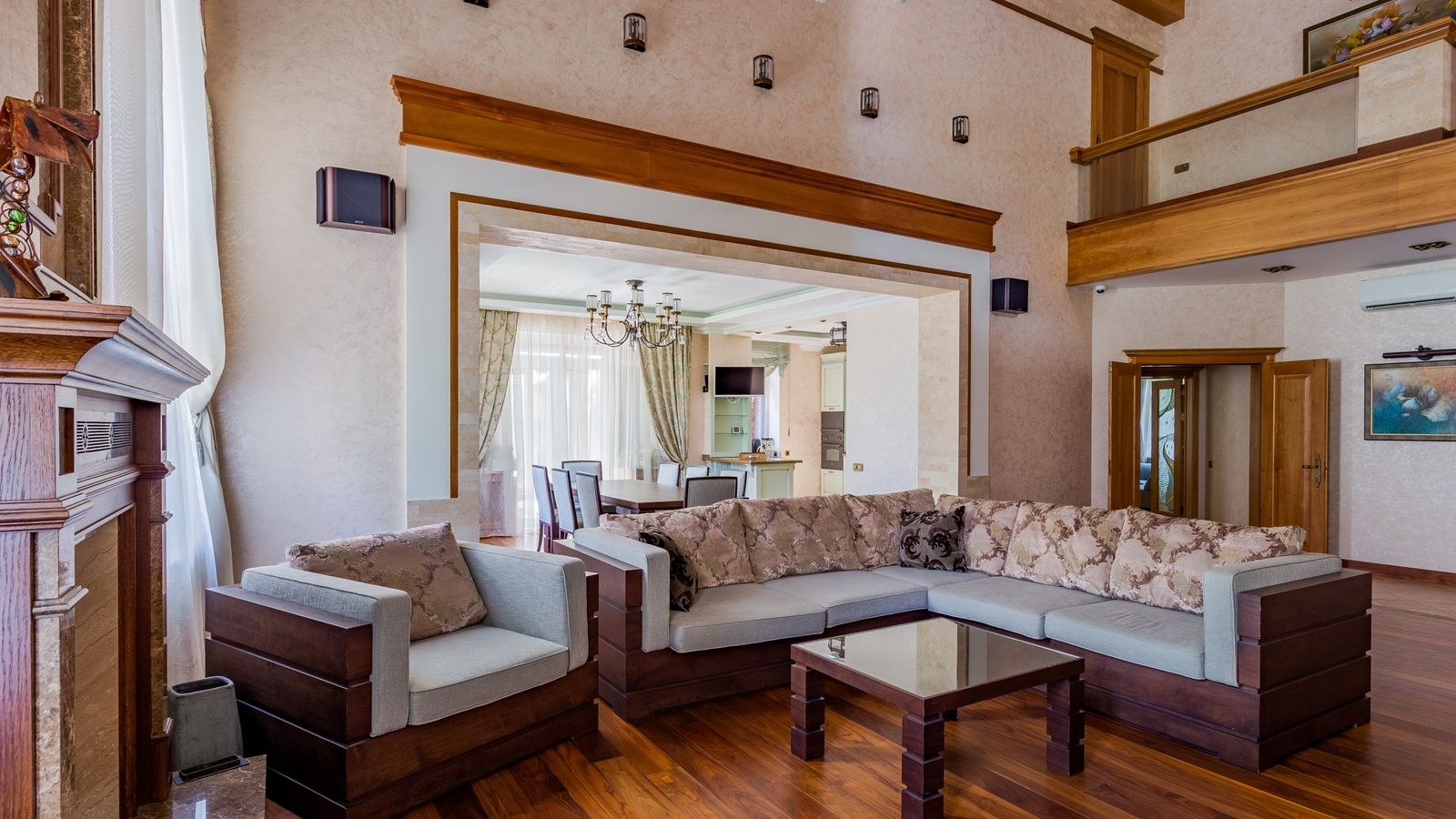 Luxurious living room featuring a large high-end sectional sofa and elegant decor