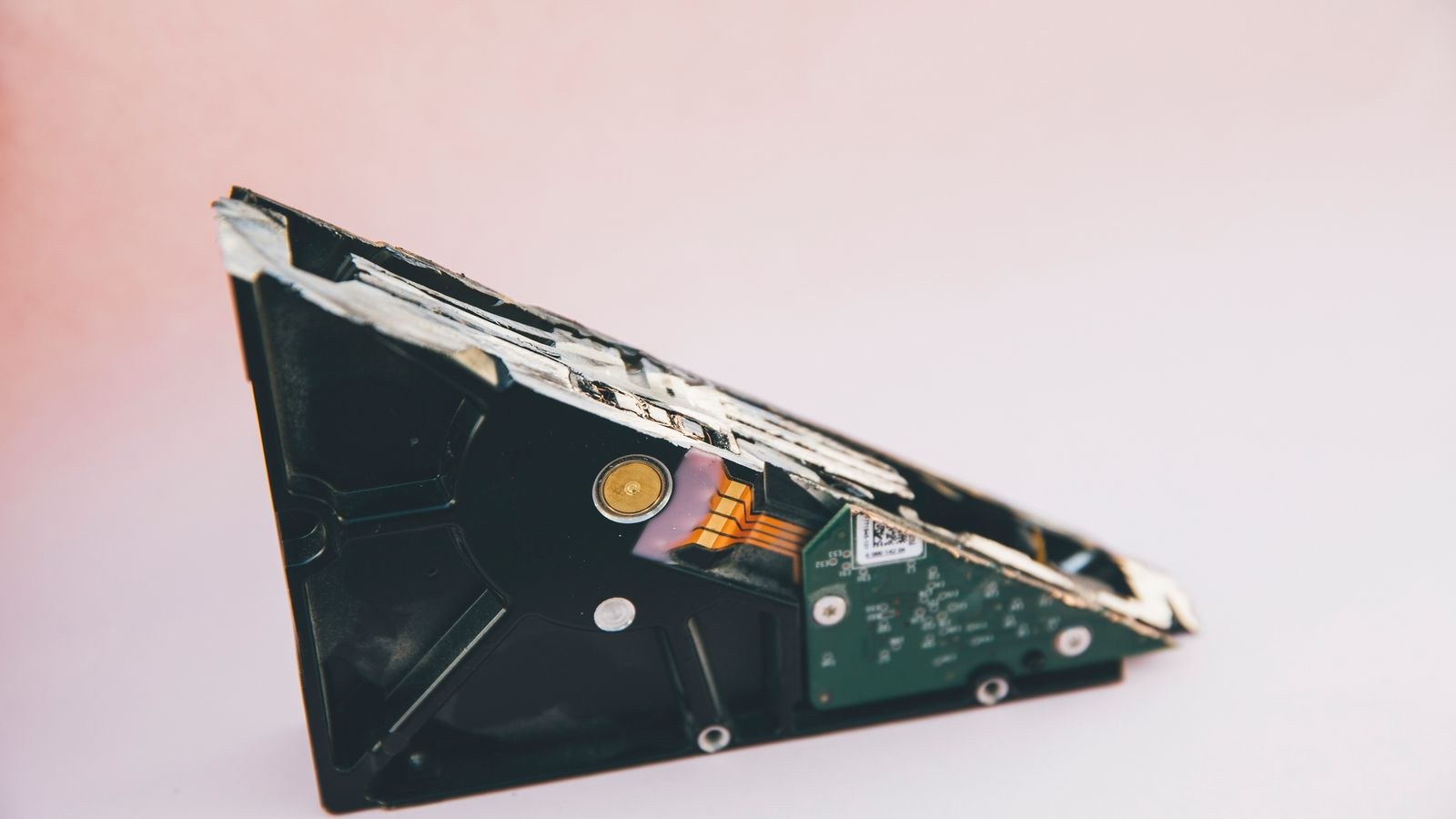 Mechanical hard disk drive circuit board next to storage hardware