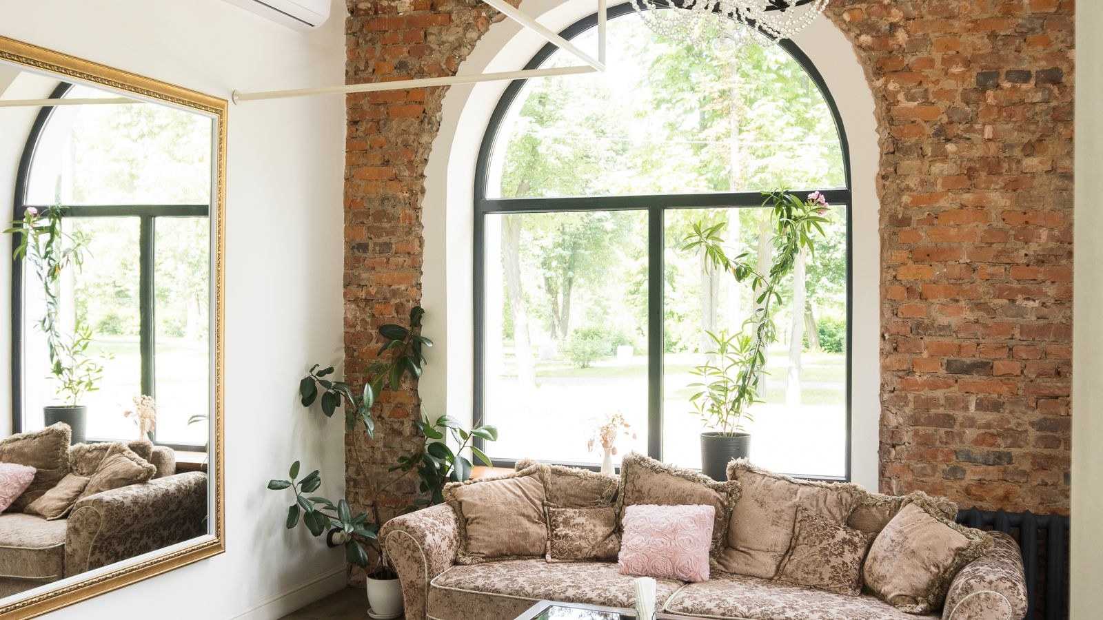 Wooden coffee table sized correctly in front of a sofa in a living room