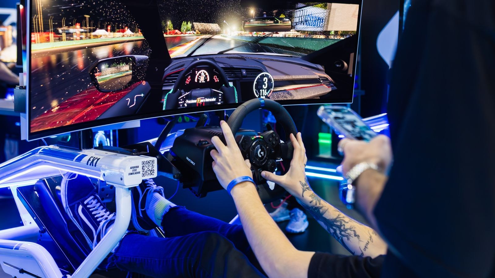 Immersive racing simulator using a large curved monitor at a tech exhibition