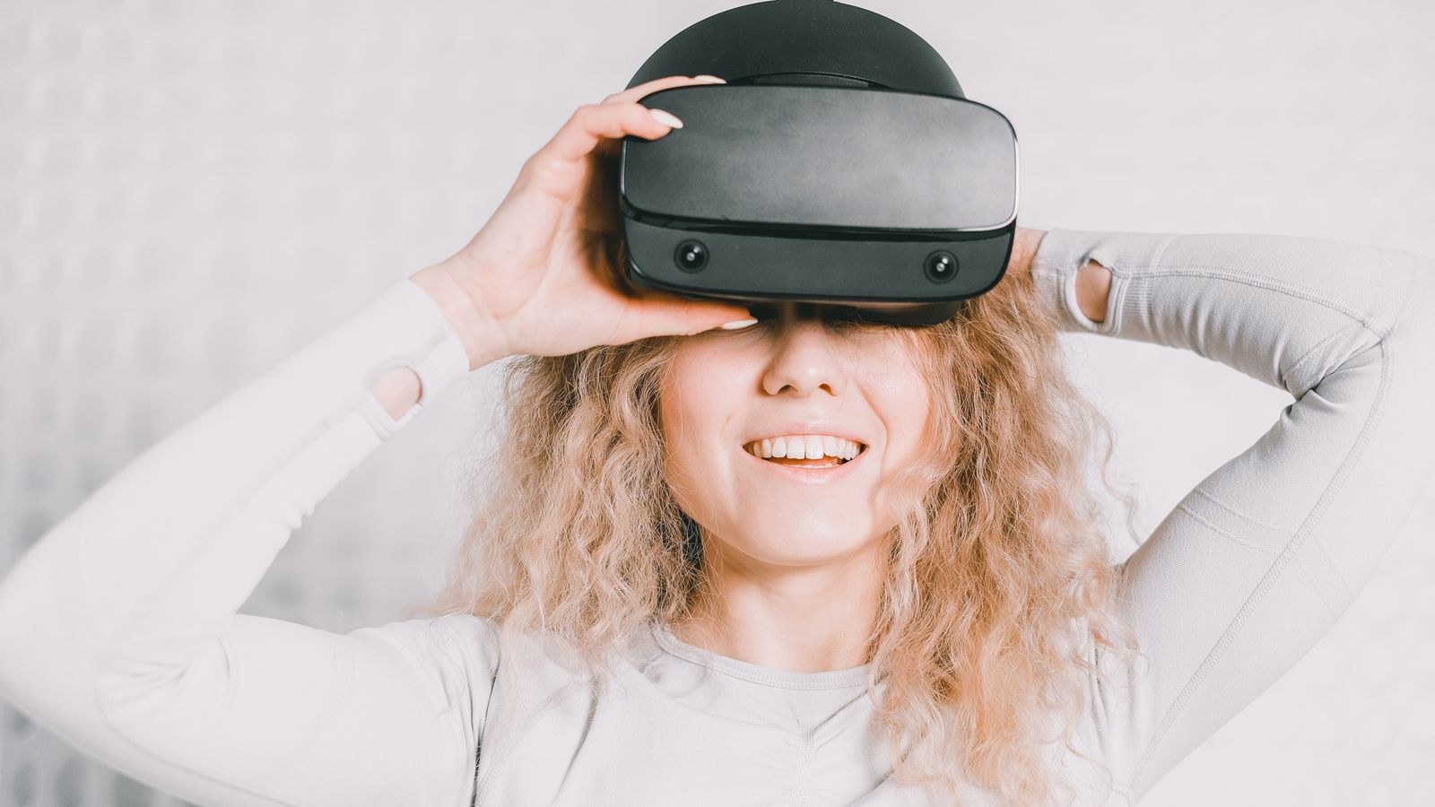 Person wearing a wireless VR headset in a home play space