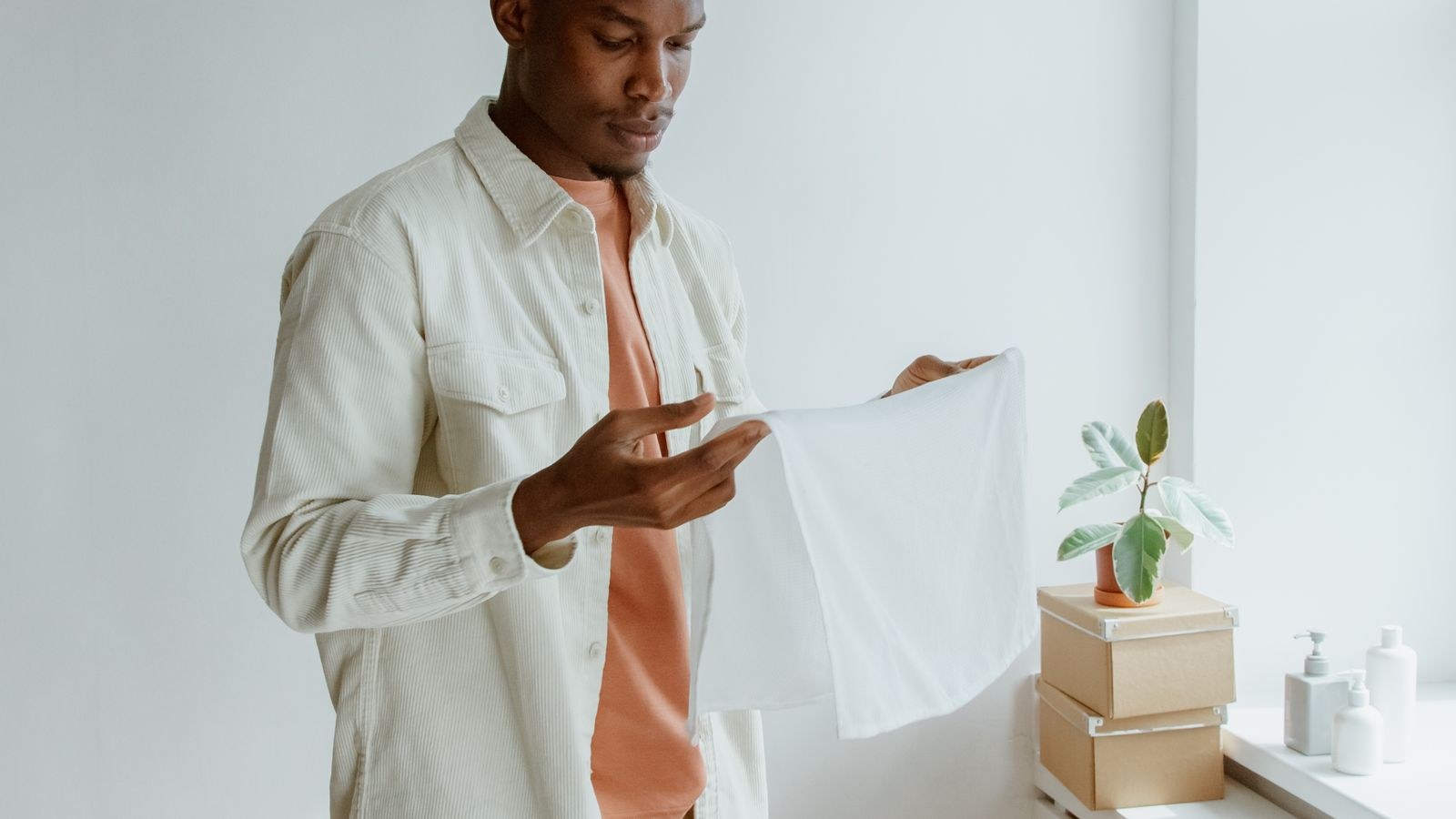 Clothes drying indoors in a home where a dehumidifier controls moisture