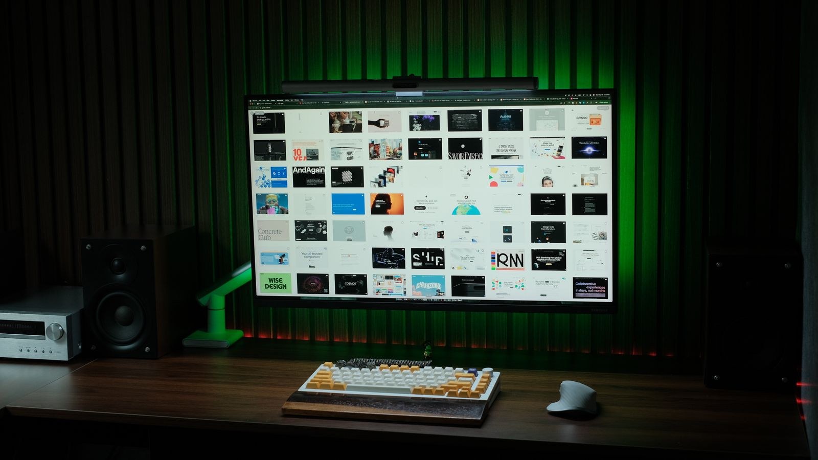 Sleek computer setup with monitor keyboard and desktop speakers