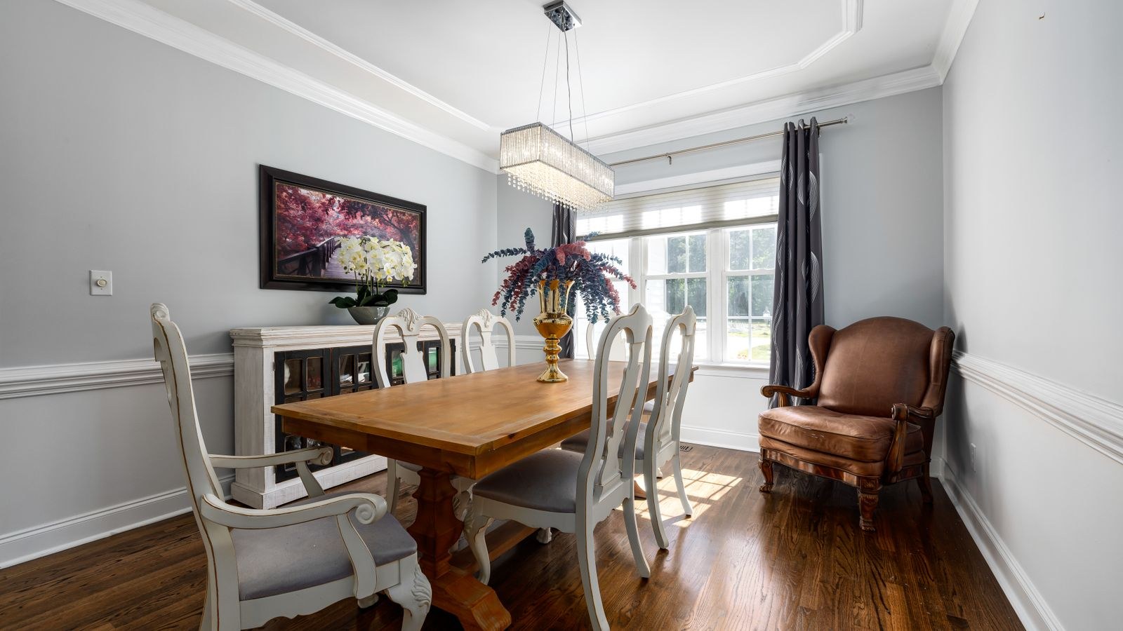 Round dining table with chairs in a bright open kitchen