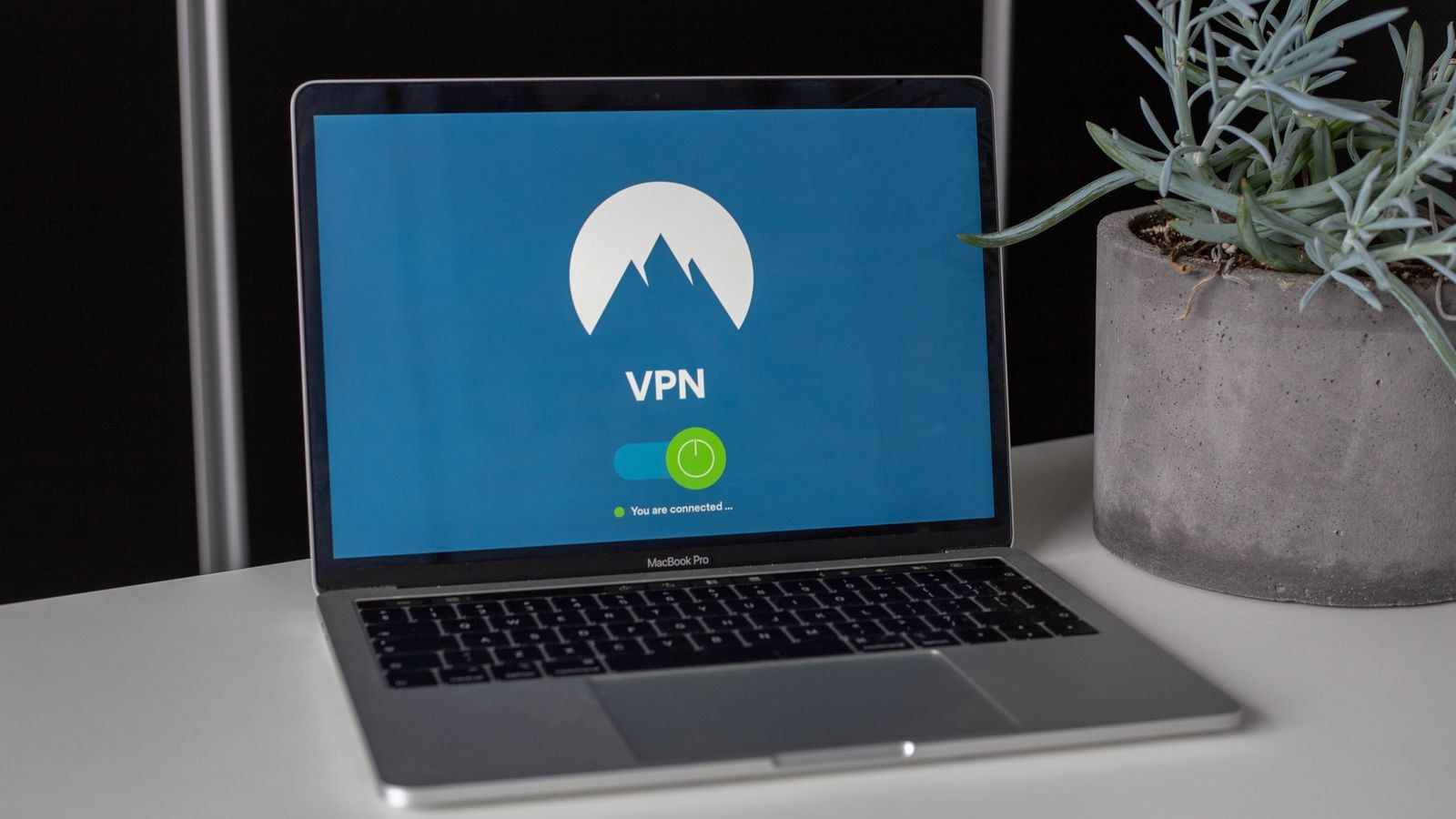 Laptop showing router admin settings while disabling WPS and UPnP features