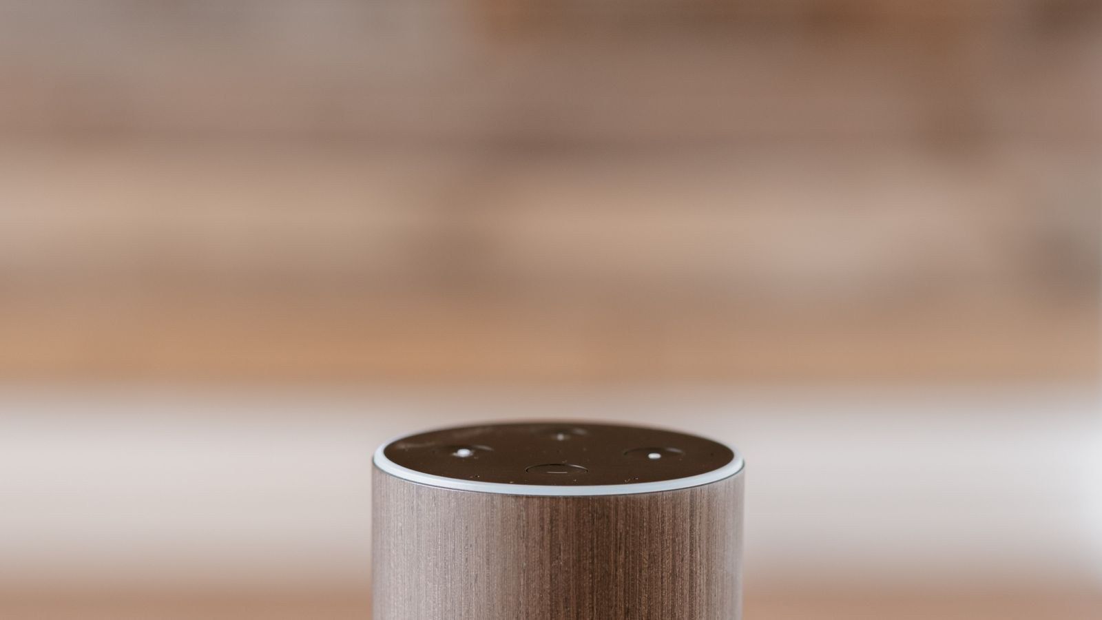 Compact smart home hub connected to a router on a shelf