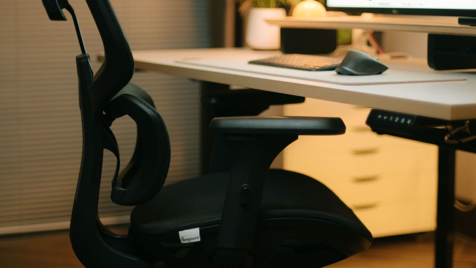 Modern ergonomic chair with adjustable head support in a home office