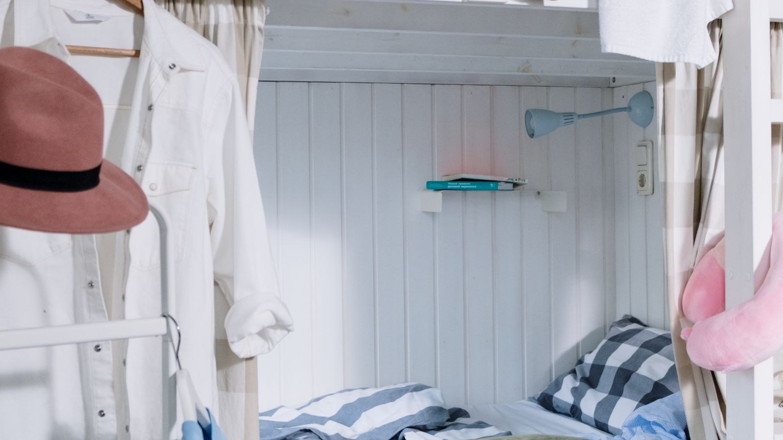 Tidy dorm room with bunk bed and storage where students secure valuables