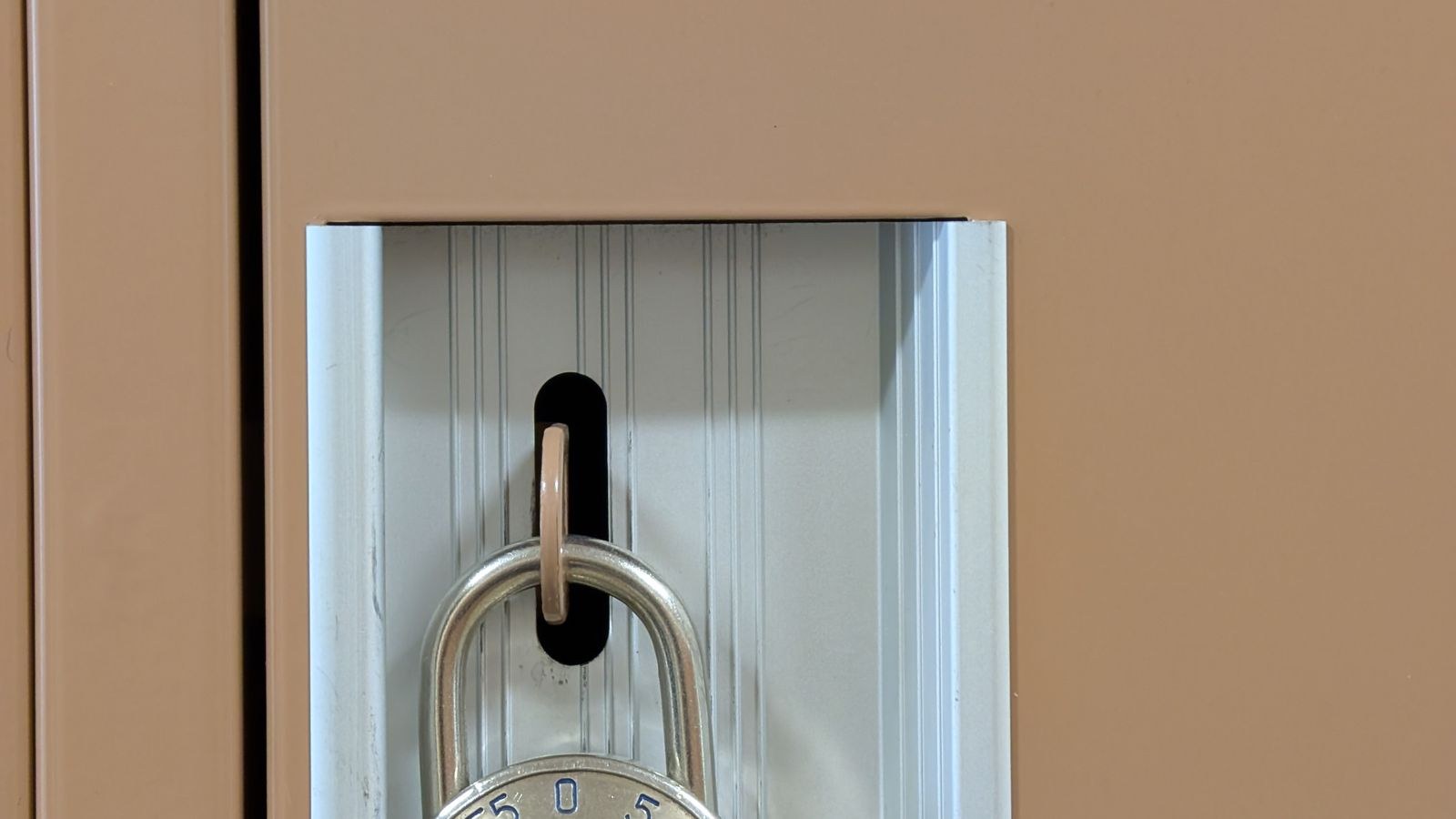 Combination padlock securing a locker for student dorm room security