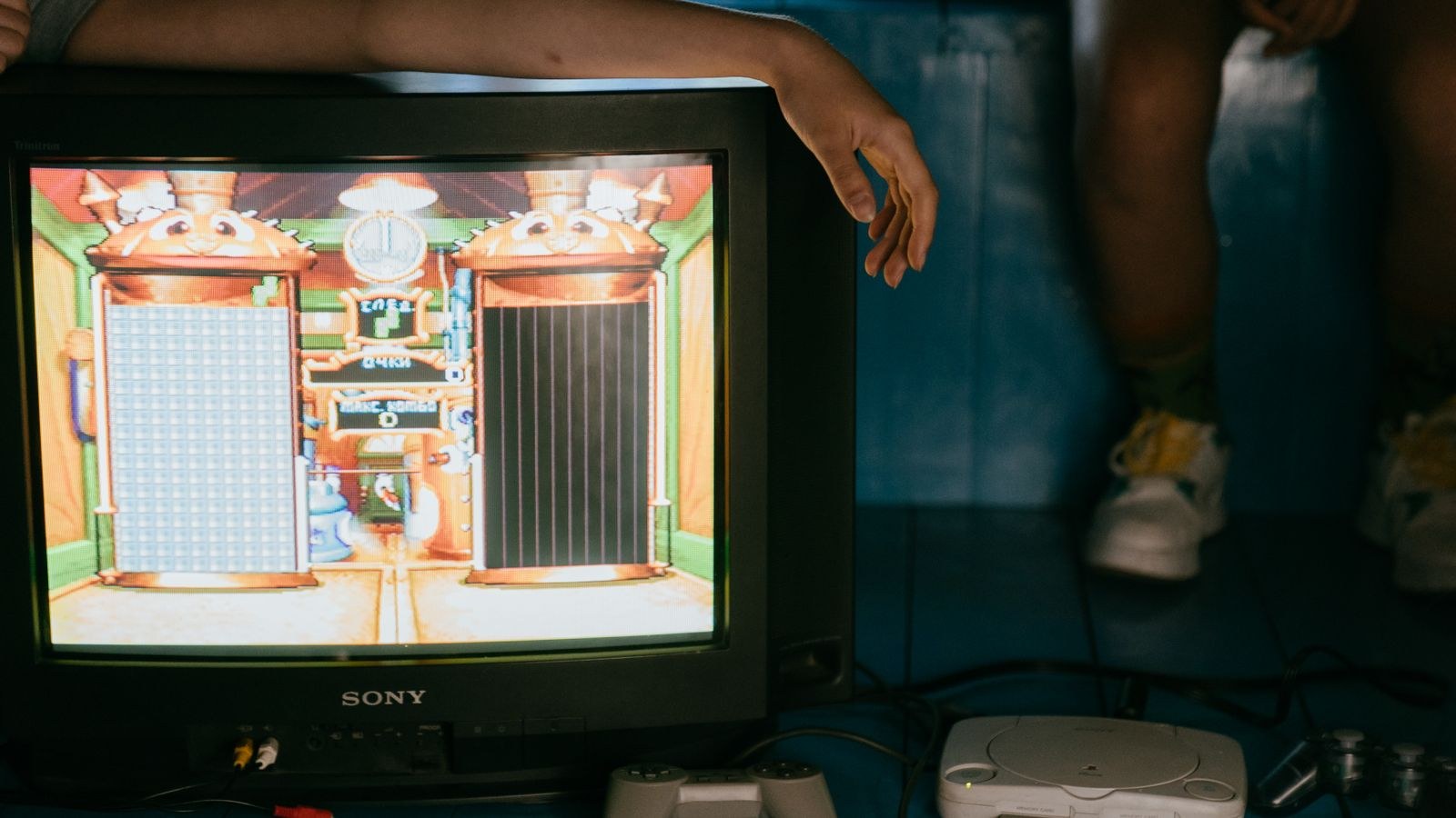 Close up of HDMI ports on the back of a TV with a cable connected