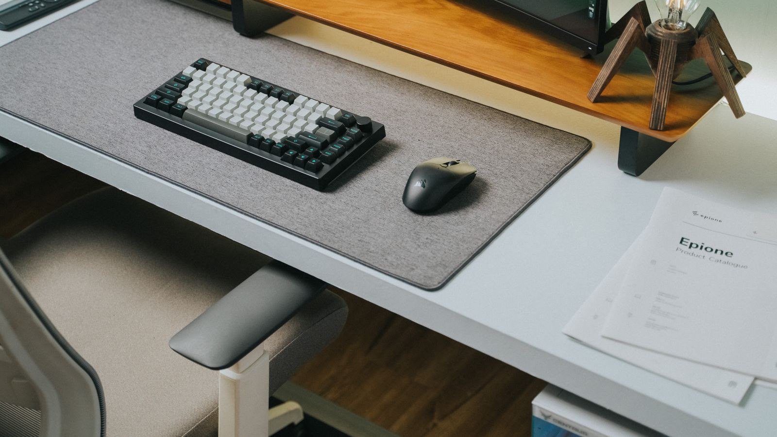Sleek office desk with wireless ergonomic keyboard and mouse