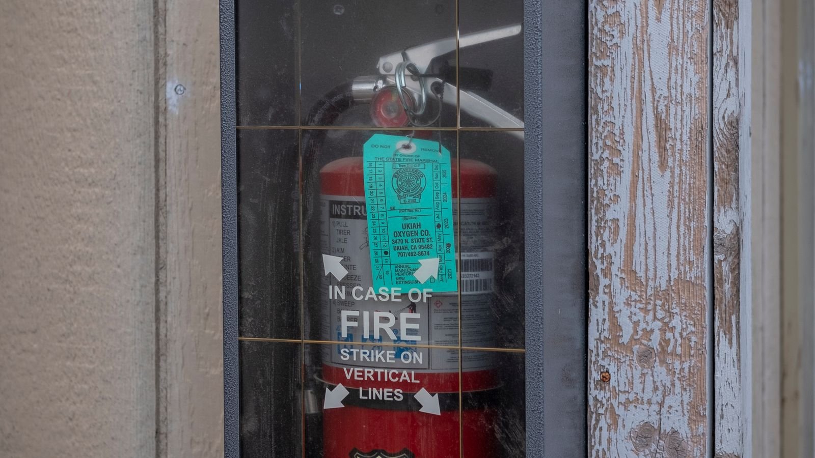 Fire extinguisher mounted near a doorway as part of a home fire safety plan