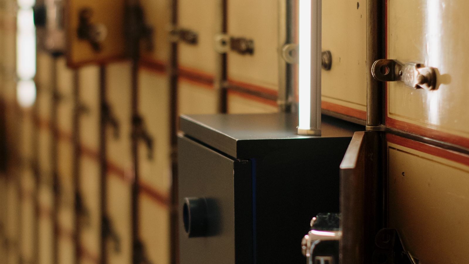 Open bank safety deposit boxes showing secure document storage compartments