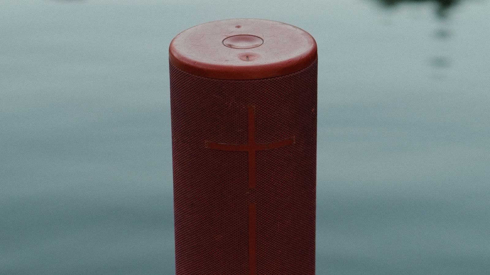 Wireless speaker placed near a router showing potential Bluetooth interference