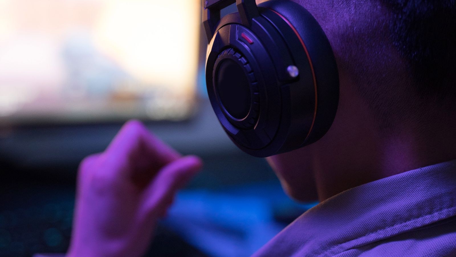 Person wearing a headset with microphone during an online voice call