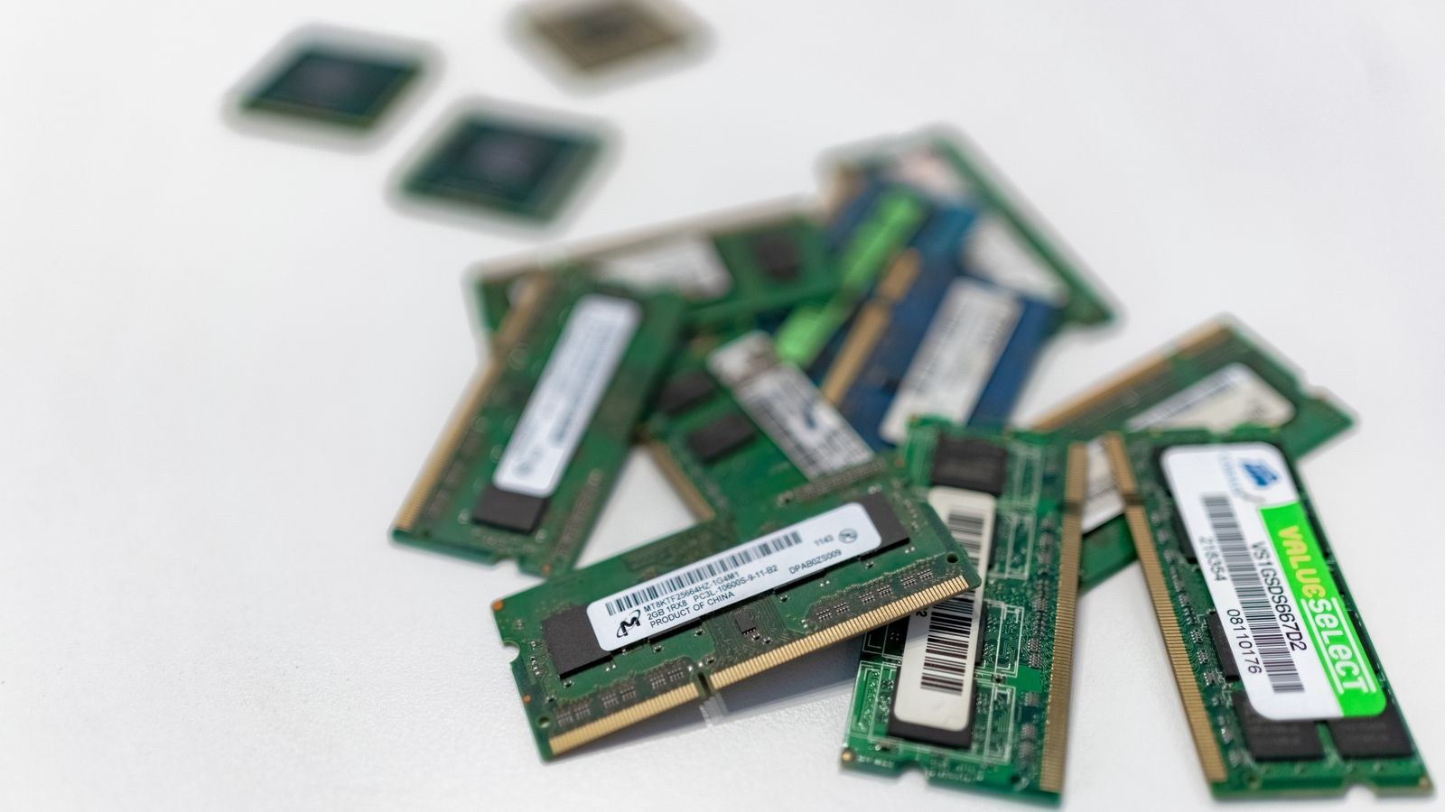 Assorted RAM modules laid out for testing one stick at a time