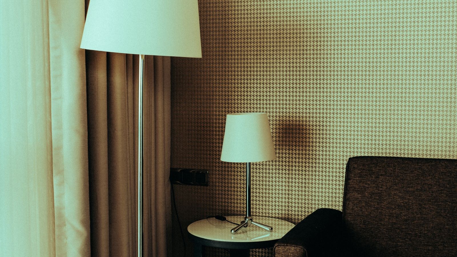 Stylish floor and table lamps arranged in a cozy living room setting