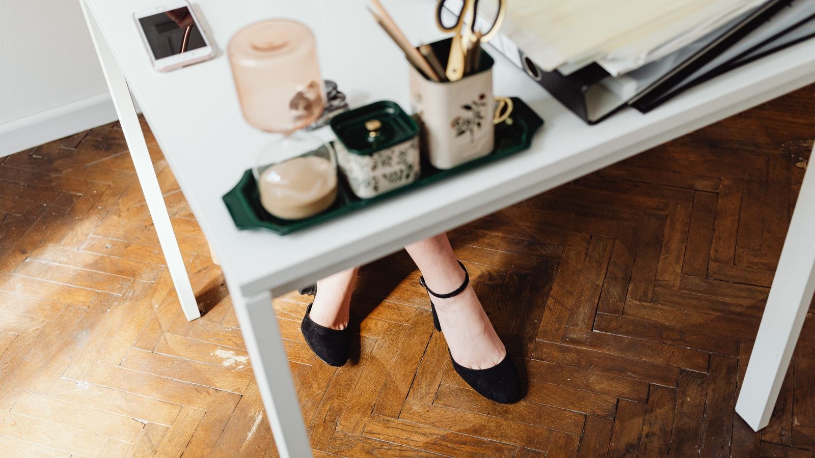 Minimalist desk setup with a clear view of the floor space underneath