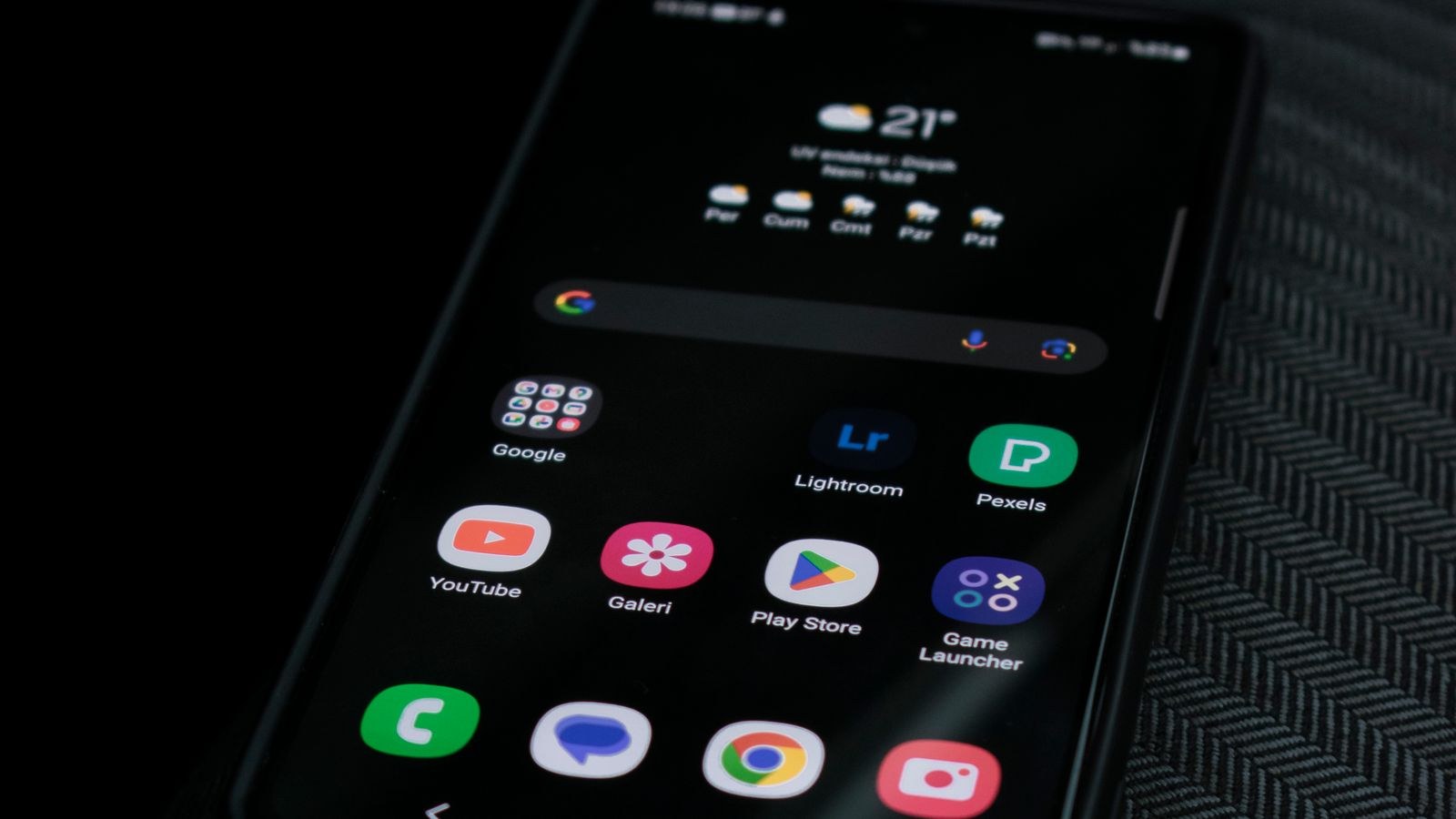 Person checking a security notification from a home sensor on a smartphone