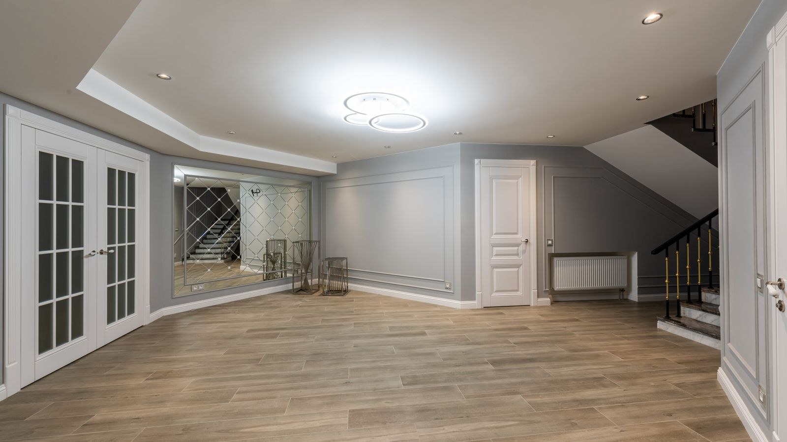 Interior staircase with wall lighting illuminating the treads