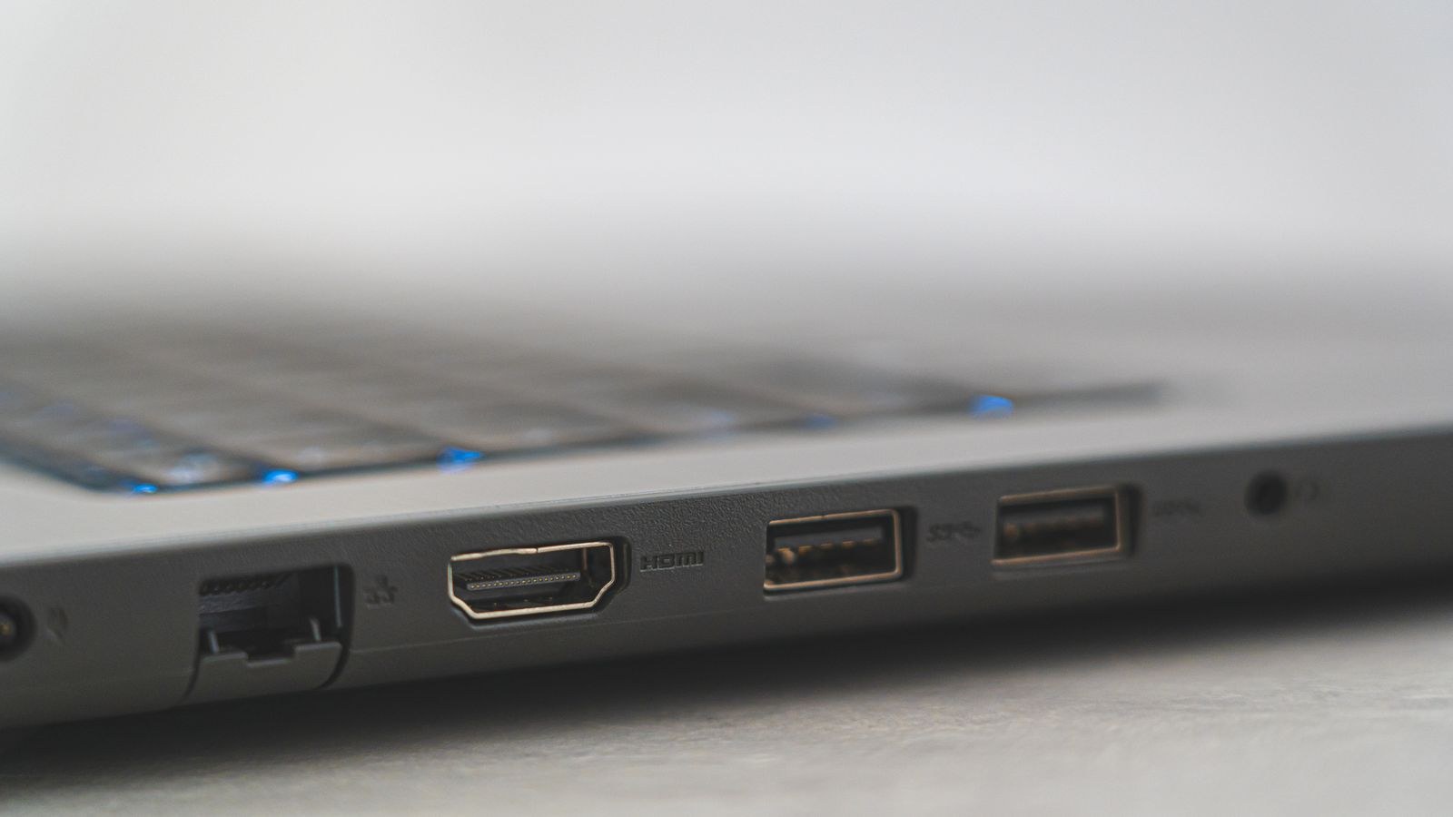 Close up of laptop ports including HDMI USB and Ethernet connections