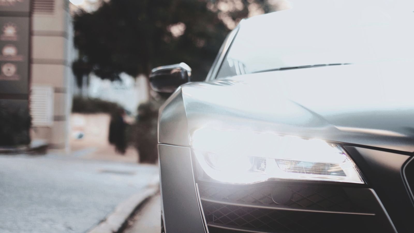 Close-up of a modern car headlight assembly at night