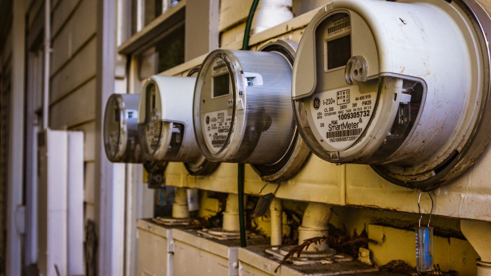 Smart electricity meters installed on the exterior wall of a home