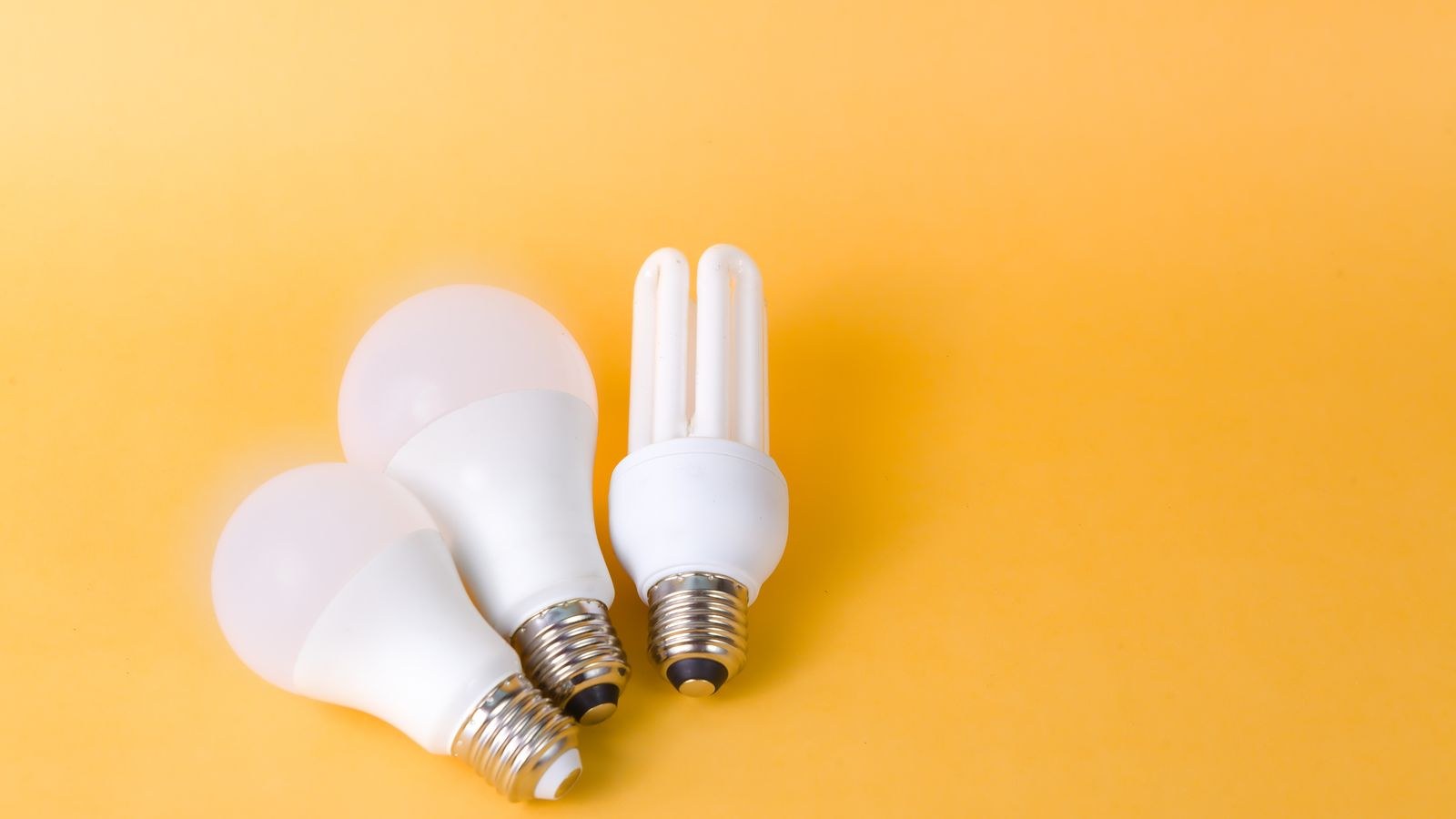 Bright LED and CFL bulbs demonstrating lumen output for room lighting calculations