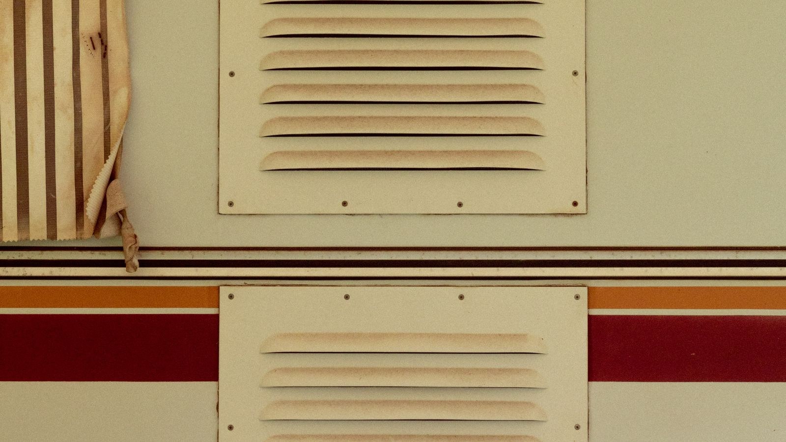 Home wall return air vent grille where a furnace filter is installed