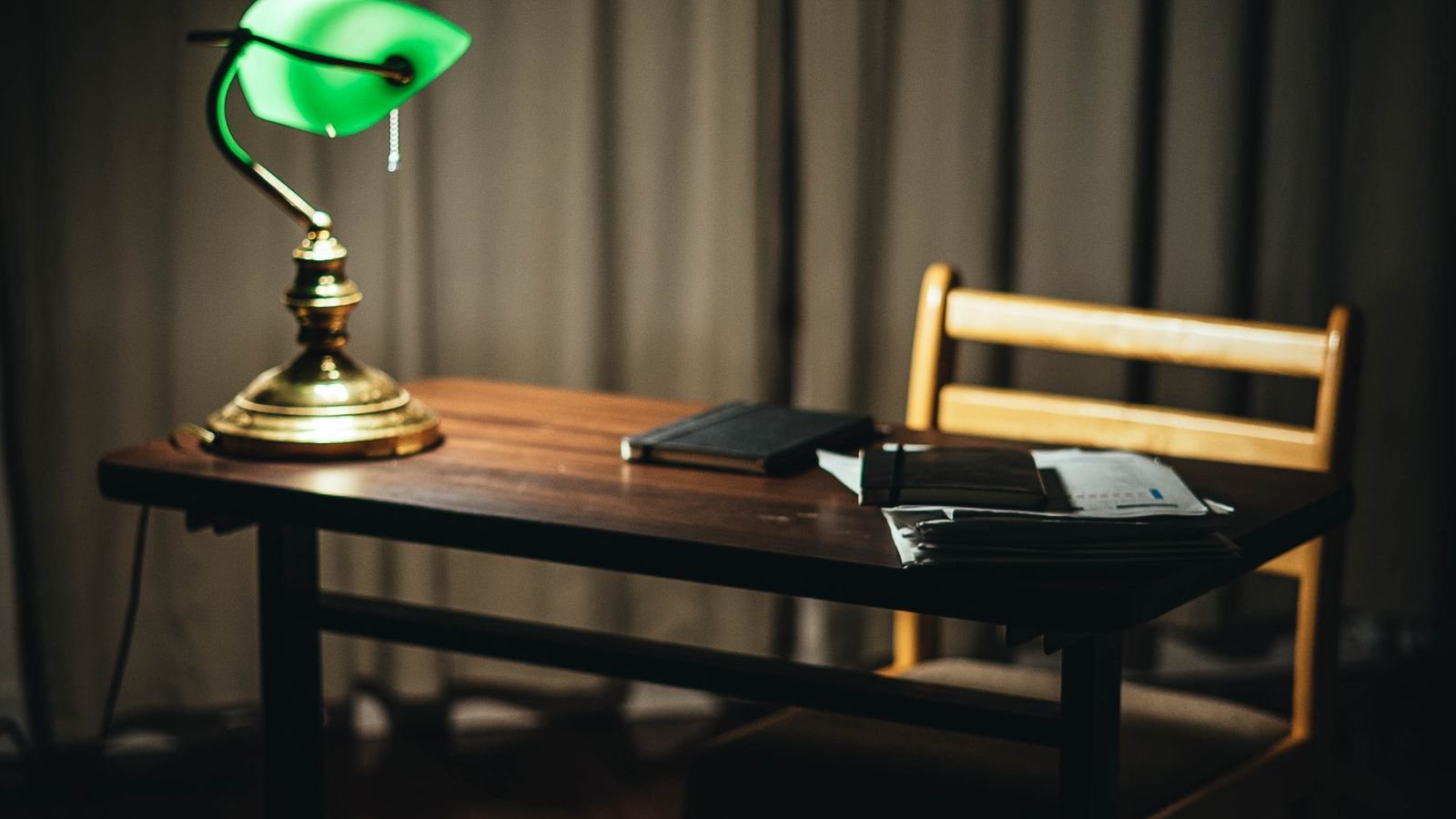 Home office desk with a lamp providing soft glare free lighting
