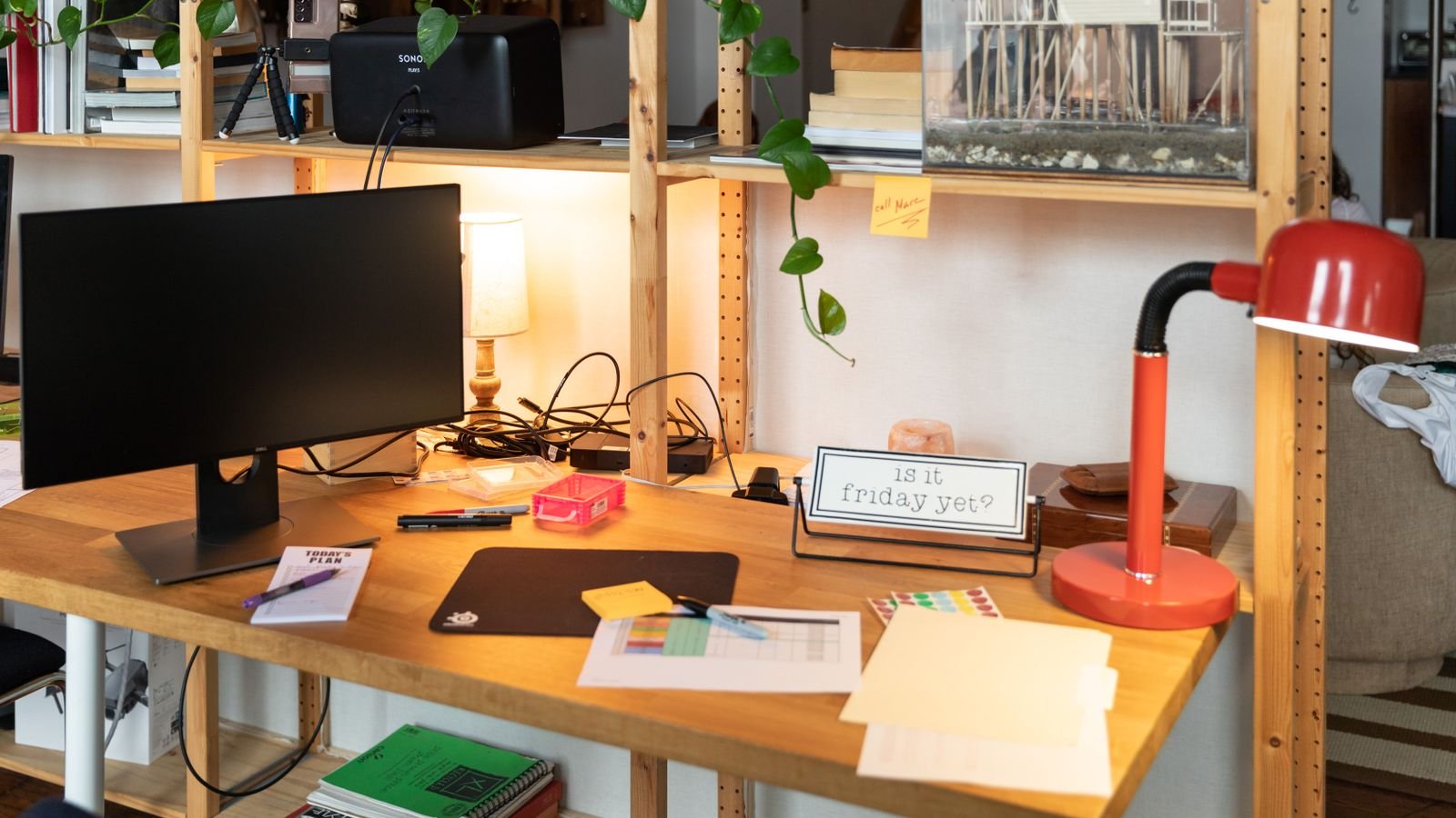 Bright home office workspace with layered lighting and a computer monitor