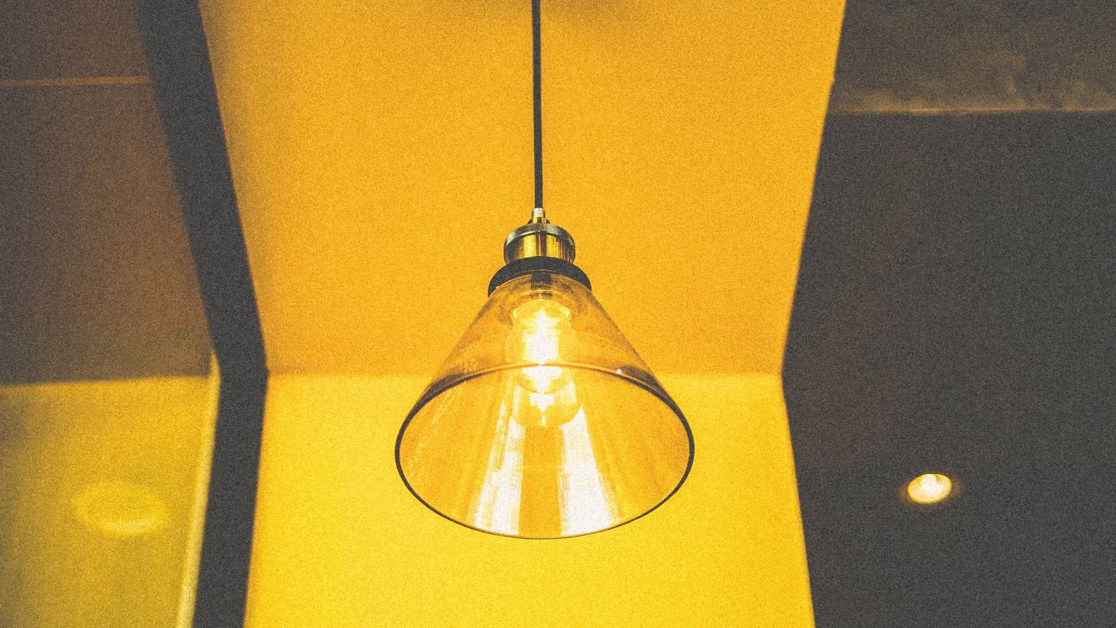 Row of table lamps with warm white bulbs illuminating an interior space