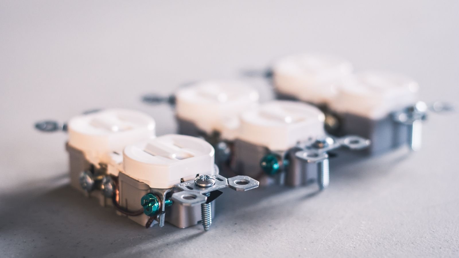 Close-up of electrical outlets and wiring during a kitchen installation