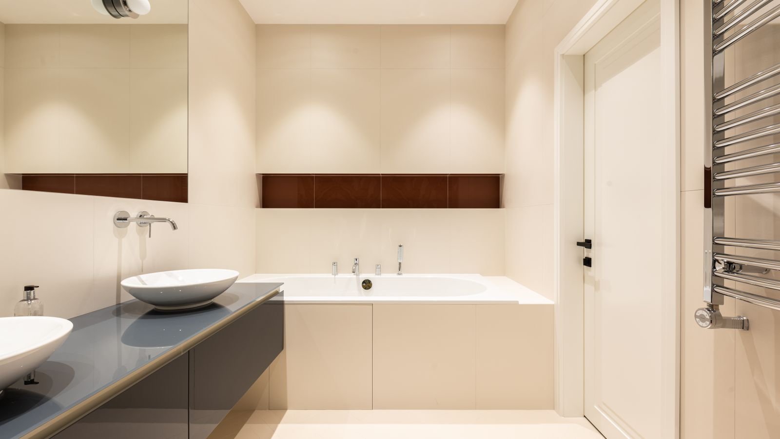 Ceiling downlight trim detail in a bright interior space