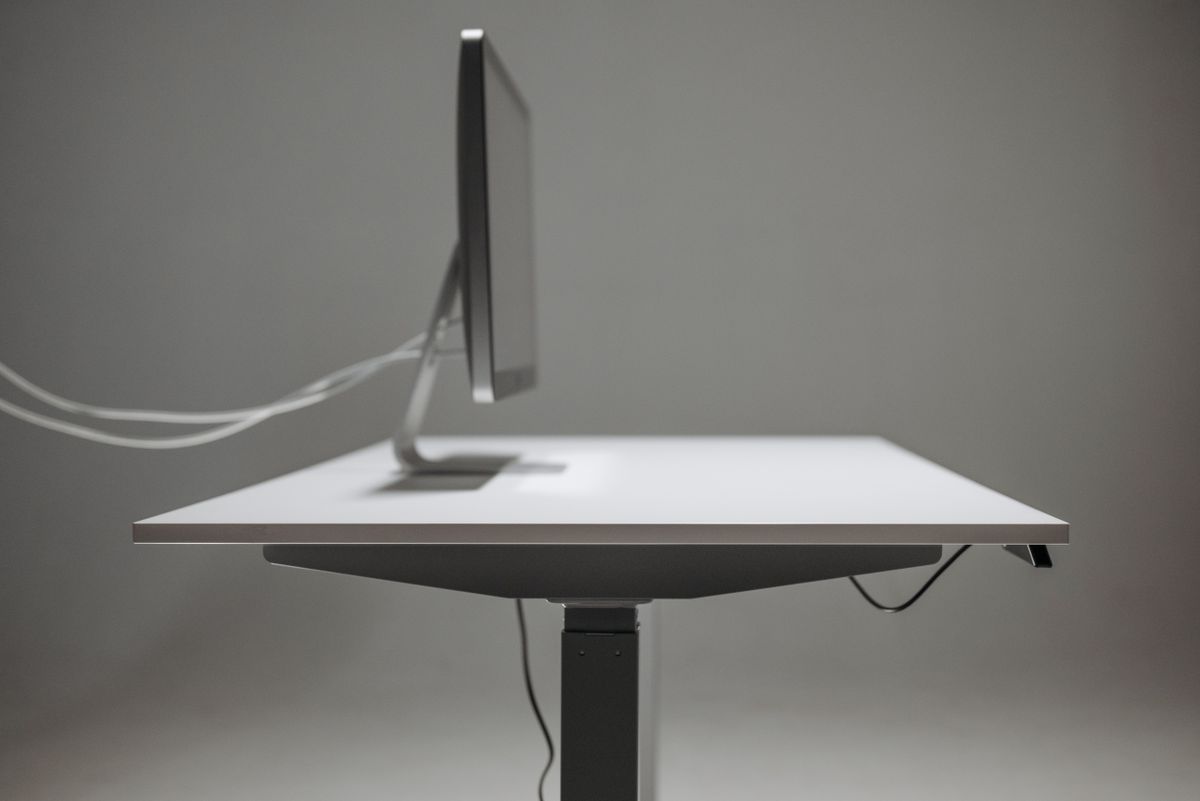 Close-up of a dual-motor standing desk frame