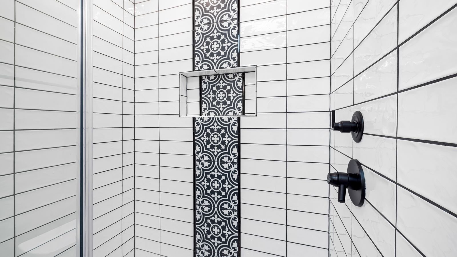 Tiled shower floor with grout lines that need sealing